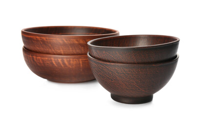 Stylish brown clay bowls on white background