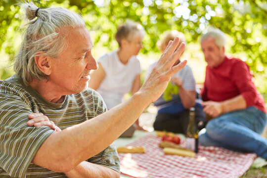 Senior Picnic In The Park With Friends