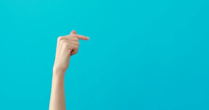 Close-up of a woman hand pointing to the right side