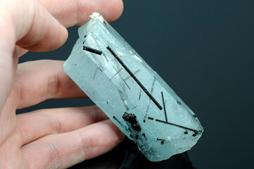 Natural blue aquamarine huge hexagonal raw rough translucent crystal with black tourmaline crystals...