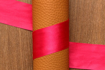 tape around the roll of genuine leather