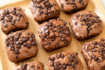 dark chocolate brownies topped by chocolate chips