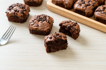 dark chocolate brownies topped by chocolate chips