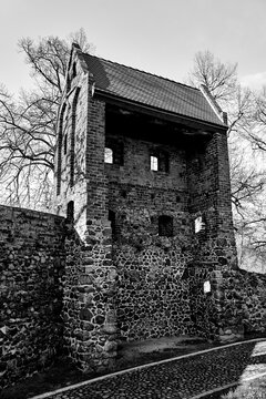 Medieval defensive walls with a tower in the city of Osno