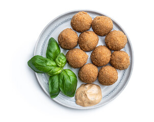 Mini scotch eggs in ceramic plate isolated on white