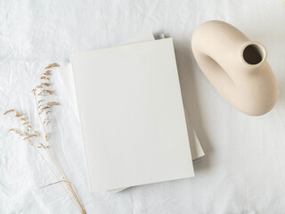 Empty blank white magazine cover mock up, vase and dried grass