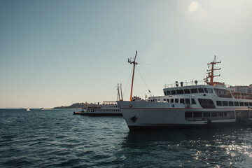 Fototapeta na wymiar blue, cloudless sky over vessels floating on Bosphorus strait