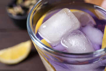 Fototapeta na wymiar Organic blue Anchan with lemon in glass on table, closeup. Herbal tea