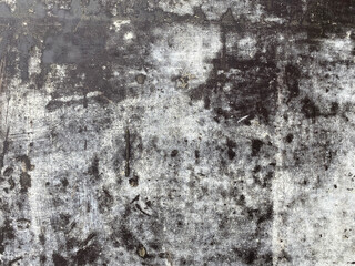 Top view of black, white, gray grunge textured rough stone background with cracks, scratches and stains. Creative concrete backdrop. 