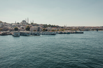 view of city, and ships moored on seashore, Istanbul, Turkey