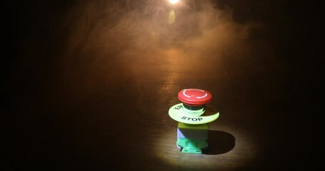 Emergency stop button, Disaster protection. Industrial concept. Red button on table in dark low key background. Selective focus