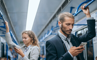 young business men traveling in the subway.