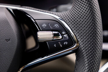 Buttons on steering wheel in a new modern car