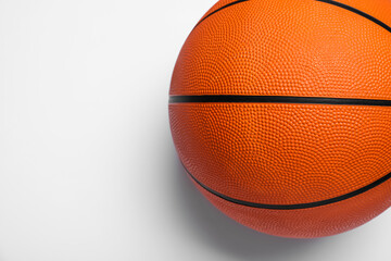 Fototapeta premium Orange ball on white background, top view. Basketball equipment