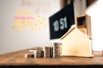 Money coin Grow up business and computer Concept,Silver coins stacked on wooden desks.