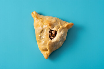 Traditional middle eastern fatayer on blue background