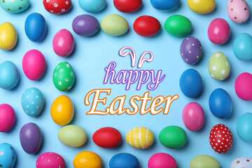 Happy Easter. Frame of bright painted eggs on light blue background, flat lay