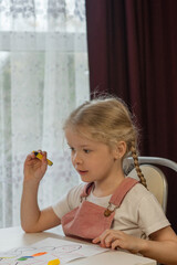 little girl painting at home
