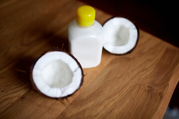 Fototapeta na wymiar Fresh healthy coconut milk in a glass on wooden table background