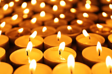 Many burning candles as background. Memory day