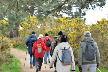 Retired Hikers on the path at Ploumanach in Brittany. France
