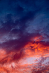 Fototapeta na wymiar Beautiful epic red dark blue sunset sky. Vertical photo