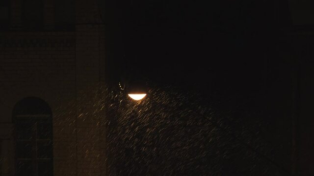 Latern Lamp on Street Swaying in the Wind Snowy Night 