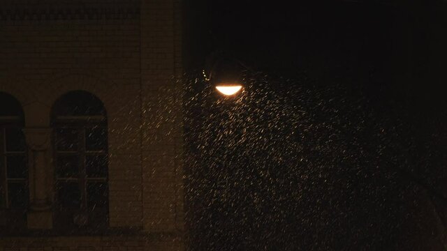 Latern Lamp on Street Swaying in the Wind Snowy Night 