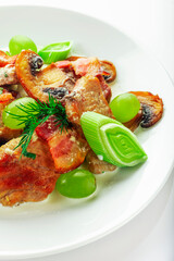 Pork with mushrooms and grapes.