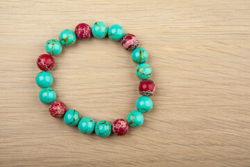 image of stone bracelet wooden desk