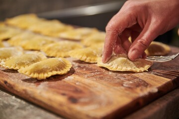 Preparing traditional italian ravioli. Homemade italian pasta.