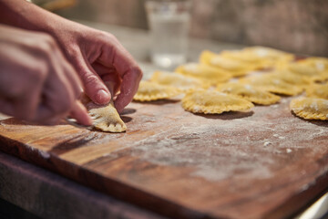 Preparing traditional italian ravioli. Homemade italian pasta.