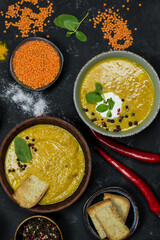 different types of lentil soup. coconut cream and herbs, spices and ingredients. vegetarian food 