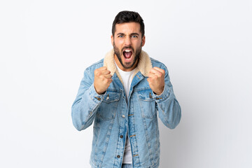 Fototapeta premium Young handsome man with beard isolated on white background frustrated by a bad situation