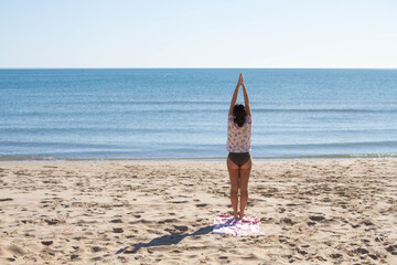 Fototapeta na wymiar Woman Meditation At Tropical Beach