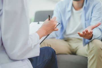 Men talk with a psychologist during talking therapy stressed mental health at office