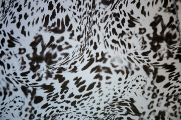 Black and white abstract camouflage. The concealment pattern on a fabric. Conception of winter masking.