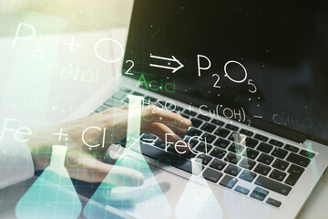 Creative chemistry illustration with hands typing on computer keyboard on background, science and research concept. Multiexposure