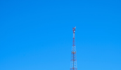 Obraz premium Telecommunications tower with blue sky equipment on telecommunications tower. Communication technologies. Telecommunications industry. Mobile or telecommunication network