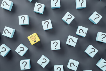 Naklejka premium Idea concept with blue wooden cubes with question sign and one yellow with light bulb on dark background