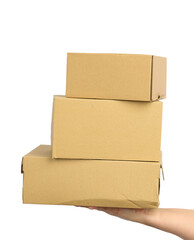hand holds a brown cardboard box of paper on a white isolated background