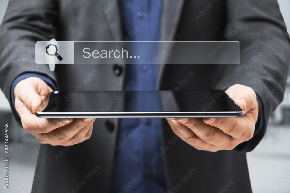 Poster Searching information data on internet concept with businessman with digital tablet in hands and digital search box with loupe