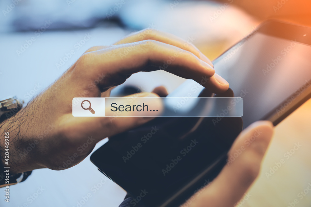 Poster Mobile browsing and searching concept with man using digital tablet