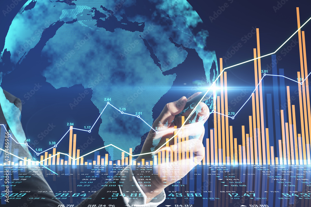Poster Financial analytics and analysis concept with businessman hand writing on touch screen with stock market chart graphs and digital world map