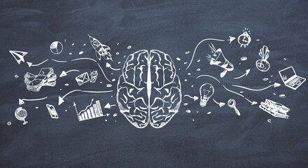 Brainstorming concept with black painted illustration of brain and business process symbols on chalkboard