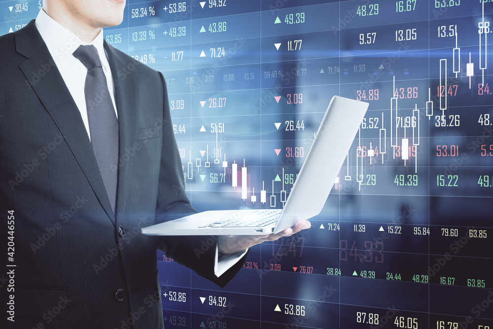 Poster Analyzing and analytics concept with businessman with laptop on digital scoreboard with growing graphs and markets quotes background