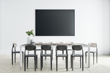 Empty black poster on light wall in modern dining room with monochrome chairs, wooden table and floor. Mockup