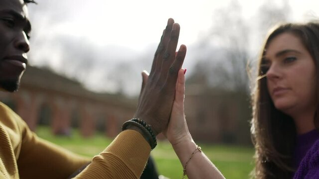 Interracial couple holding hands together, diversity union