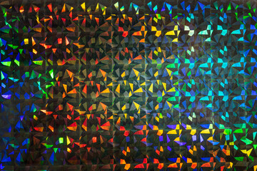 glitter grid pattern background. macro photo of silver rainbow holographic foil, colorful hologram...