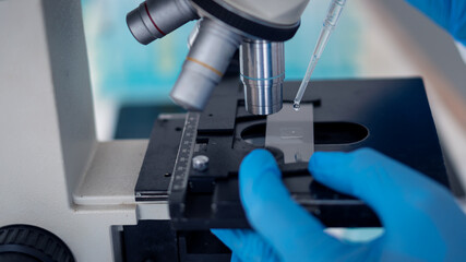 Laboratory pharmacological research scientists develop vaccines, a development project for the coronavirus, COVID-19 vaccine with a tabletop Vaccine test tube.